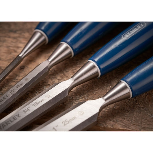 STANLEY 0-16-130 wood chisel set with blue handles, close-up of three chisels on wooden surface.