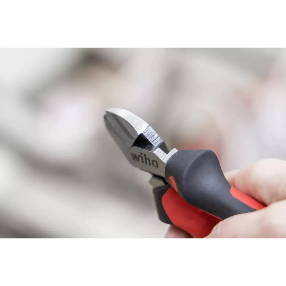 Industrial side cutter with red and black handles