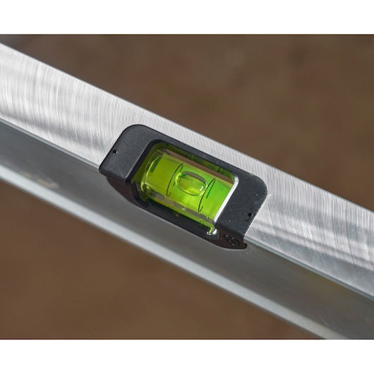 Photo of STANLEY FMHT43678-1 spirit level close-up, showing green vial on silver body.