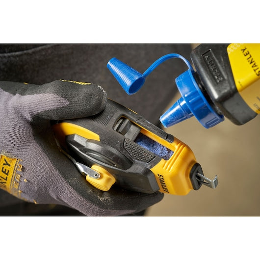 STANLEY STHT47311-0 chalk refilling in yellow and black chalk line reel, close-up photo.