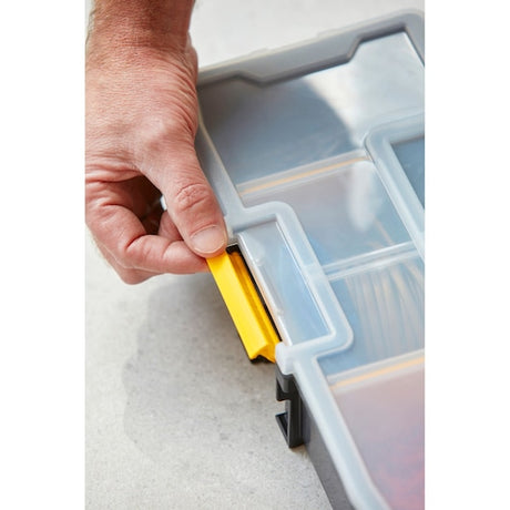 STANLEY 1-94-745 organiser close-up, hand opening yellow latch on clear plastic lid.