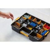 STANLEY 1-94-745 organizer box with compartments holding screws, wall plugs, and hardware, person picking screws.