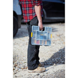Photo of a person holding a STANLEY 1-94-745 organizer with transparent lid and yellow latches, outdoor setting.