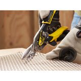 STANLEY 2-14-563 aviation snips cutting metal mesh, close-up with gloved hand holding tool.