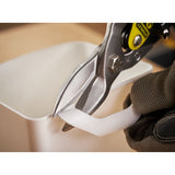 Photo of STANLEY 2-14-563 aviation snips cutting white plastic, close-up view.