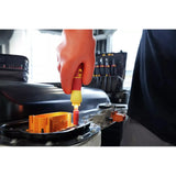 Person using an electric screwdriver on a car battery with orange gloves