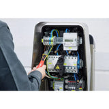 90–1,000V AC – Person using non-contact voltage detector on electrical panel