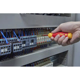 Person using an electric screwdriver on a circuit breaker panel.