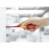 Slotted & Pozidriv – A hand using a red and yellow insulated screwdriver on a screw