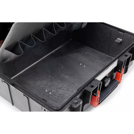 Open tool storage case with black interior and red handle.