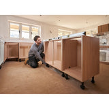 STANLEY FMHT43678-1 spirit level on wooden kitchen cabinet during installation, wide angle.