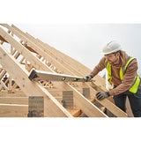 STANLEY FMHT43678-1 spirit level used by a worker on timber roof trusses at a construction site.