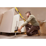 Photo of person using STANLEY FMHT83550-1 cabinet jack tool to level kitchen cabinets during installation.