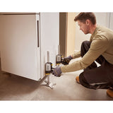 Photo of STANLEY FMHT83550-1 cabinet jack used to lift a white cabinet during installation.
