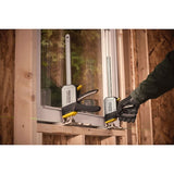 STANLEY FMHT83550-1 clamp holding window frame during installation, shown being adjusted by a gloved hand.