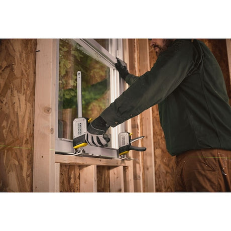 STANLEY FMHT83550-1 photography of carpenter using quick clamp on window frame installation.