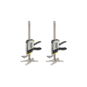 Photo of two STANLEY FMHT83552-1 heavy duty clamps with black handles and metal bars, shown from side on white background.