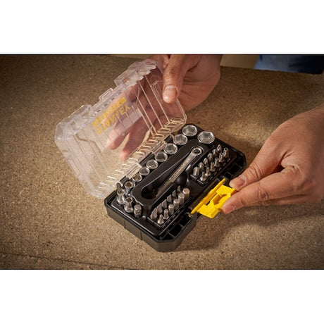 STANLEY FMMT19101-0 ratchet socket and bit set in clear case held by hands, top view