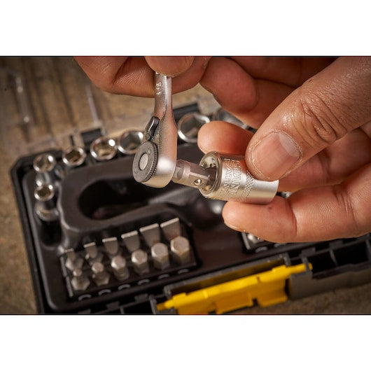 STANLEY FMMT19101-0 ratchet and socket set in use, close-up of hand attaching socket, with case and bits visible.