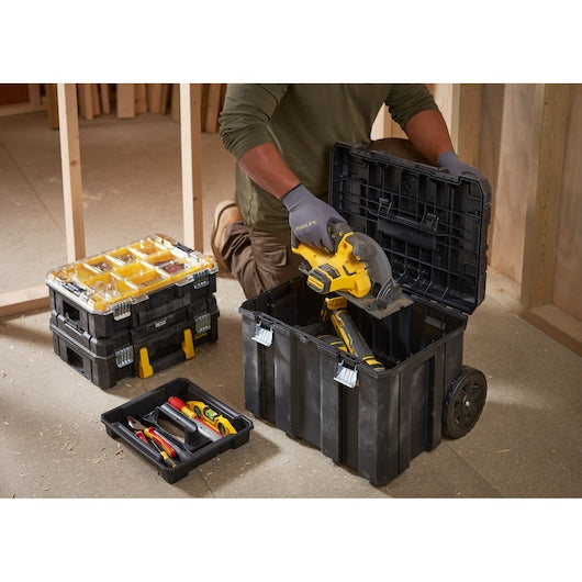 STANLEY FMST1-80101 stackable toolboxes with yellow compartments and wheeled base in jobsite setting.