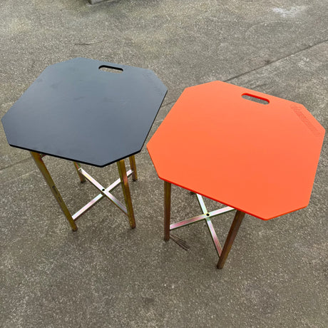 Rhinoboard Bricklayers Spot Board 595x595mm in black and orange with integrated handle; impact resistant polymer.