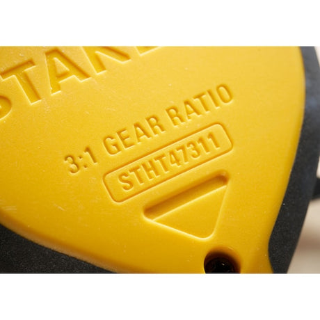 Photo of STANLEY STHT47311-0 yellow casing, embossed with 3:1 gear ratio and SKU details, close-up view.