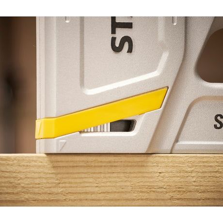 STANLEY STHT70150-0 photography of a silver square tool with yellow accent placed on wood.