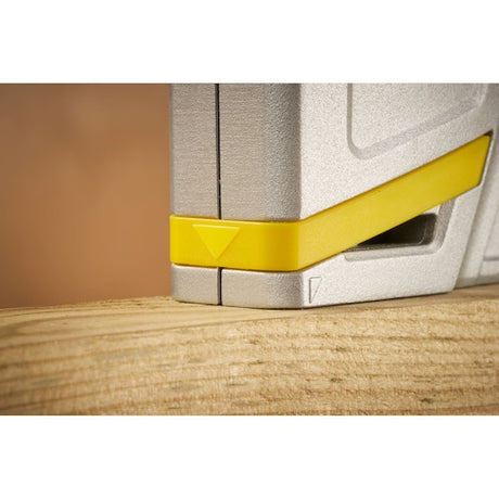 STANLEY STHT70150-0 tape measure close-up showing yellow and silver edge on wooden surface.