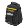 Photo of STANLEY STST1-72335 black tool backpack with yellow accents and multiple pockets, front angle.