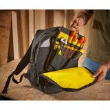 STANLEY STST1-72335 tool backpack with yellow interior, filled with hand tools, shown open on a work surface.