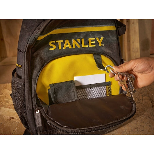 STANLEY STST1-72335 backpack front pocket with key holder, mesh pouch and yellow lining, close-up photo