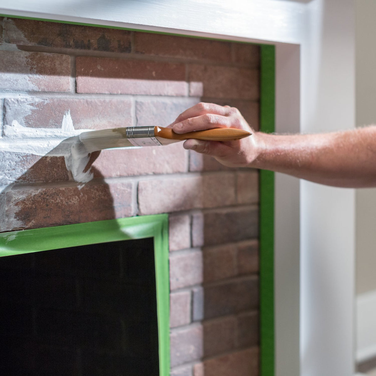 FrogTape Multi-Surface 48mm in use – masking a brick fireplace