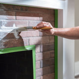 FrogTape Multi-Surface 36mm in use – masking a brick fireplace